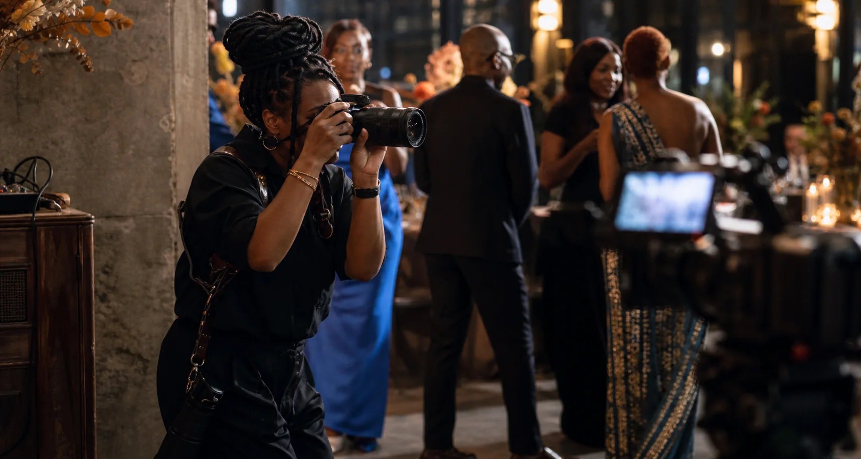 An event photographer capturing a candid moment at a celebration
